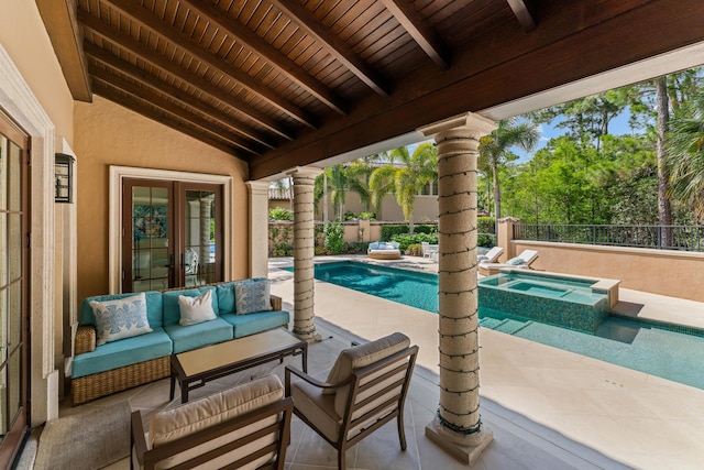 view of patio featuring a swimming pool with hot tub, an outdoor hangout area, and french doors