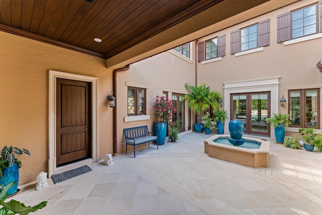 doorway to property with french doors and a patio area