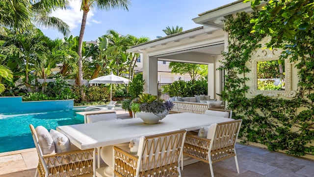 view of patio / terrace featuring a pool with hot tub and an outdoor living space