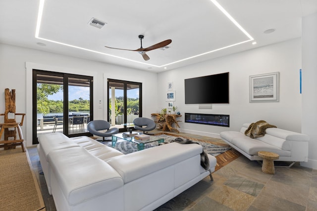 living room featuring ceiling fan