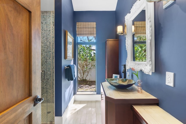 bathroom featuring vanity and walk in shower