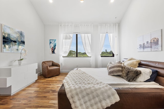 6787 Bayshore Dr, Lake Worth, FL 33462 - bedroom with wood finished floors, lofted ceiling, and baseboards