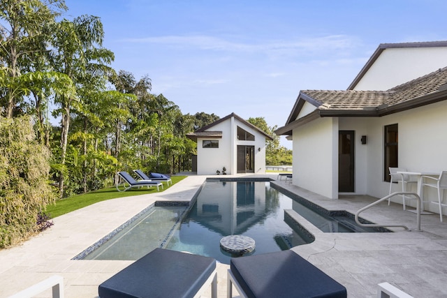 6787 Bayshore Dr, Lake Worth, FL 33462 - swimming pool with a storage structure, an outdoor structure, and a patio