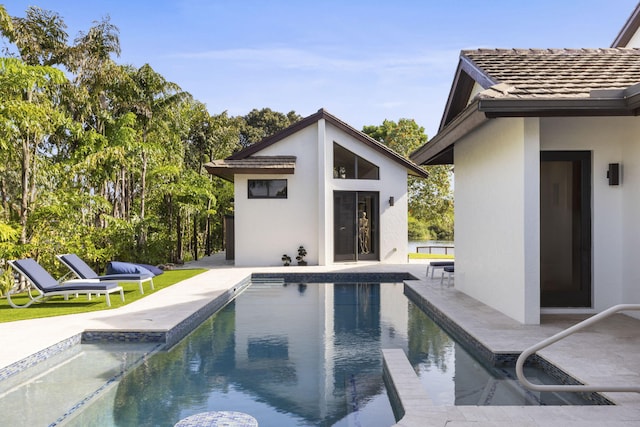 6787 Bayshore Dr, Lake Worth, FL 33462 - outdoor pool featuring an outbuilding, a storage structure, and a patio area