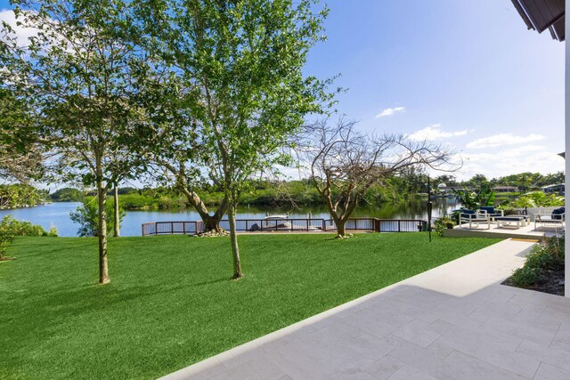 6787 Bayshore Dr, Lake Worth, FL 33462 - view of property's community with a water view and a lawn