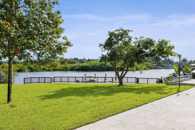 6787 Bayshore Dr, Lake Worth, FL 33462 - view of property's community featuring a water view and a lawn
