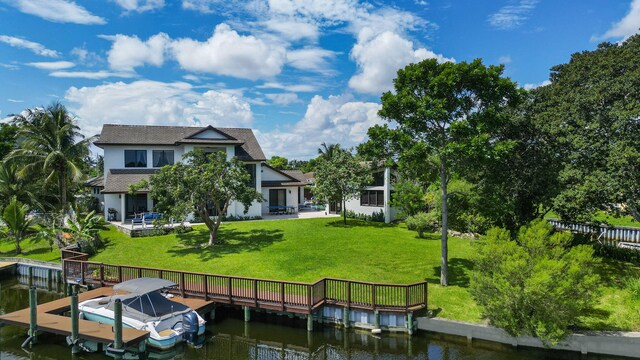 6787 Bayshore Dr, Lake Worth, FL 33462 - dock featuring a water view, a yard, and boat lift
