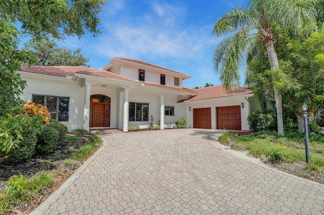 mediterranean / spanish house with a garage