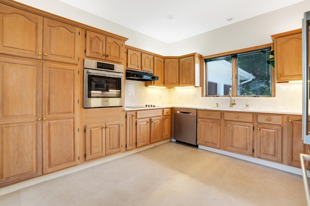 kitchen featuring sink, stainless steel appliances, and light tile patterned floors