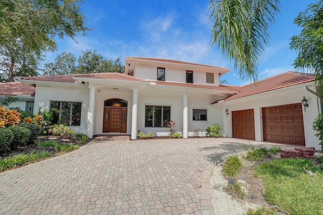 mediterranean / spanish-style house featuring a garage