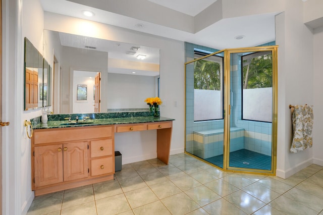 bathroom featuring an enclosed shower, vanity, and tile patterned floors