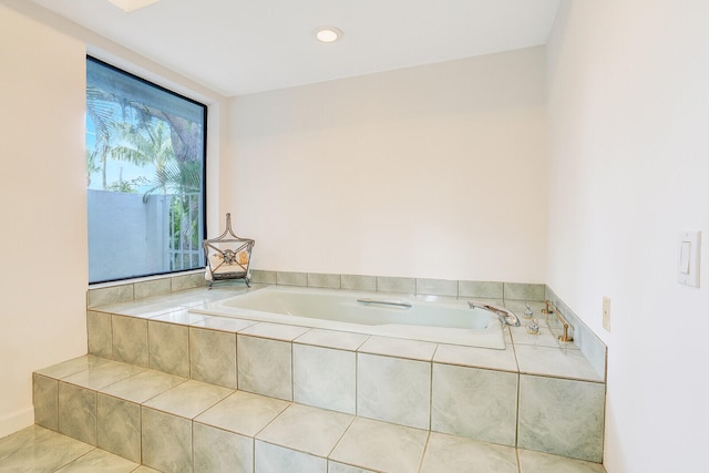 bathroom with tiled bath