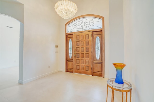 foyer with a notable chandelier and a high ceiling