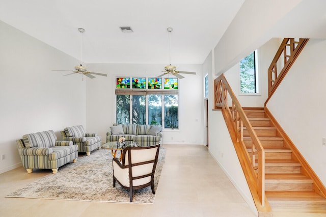 tiled living room with ceiling fan