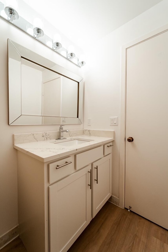 bathroom featuring vanity and hardwood / wood-style floors