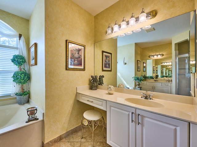 bathroom with tile patterned flooring, vanity, and independent shower and bath