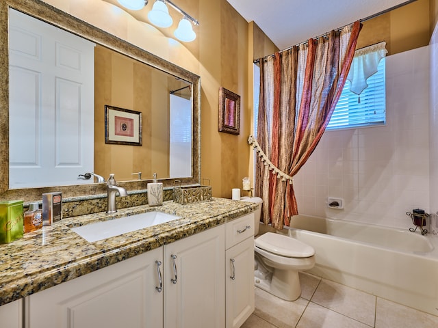 full bathroom featuring shower / bath combo with shower curtain, tile patterned flooring, vanity, and toilet