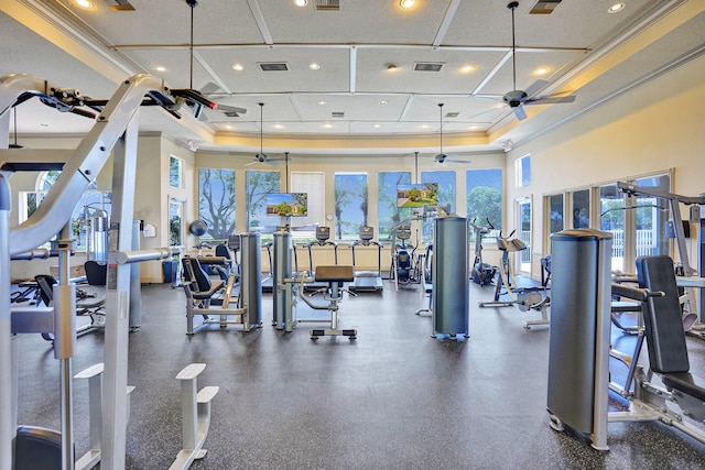 gym with ceiling fan and ornamental molding