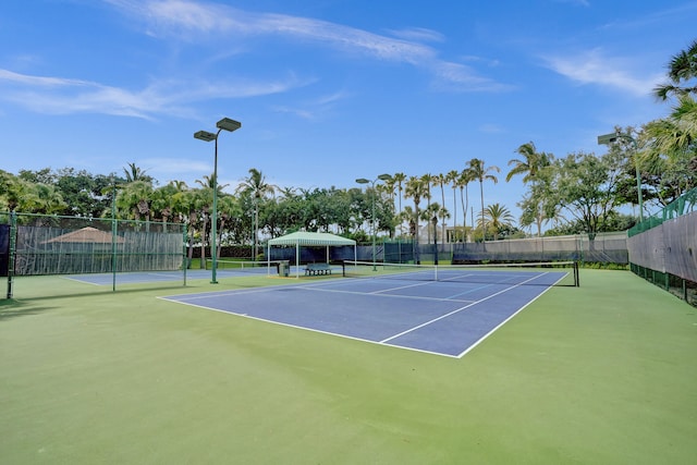 view of sport court with basketball hoop