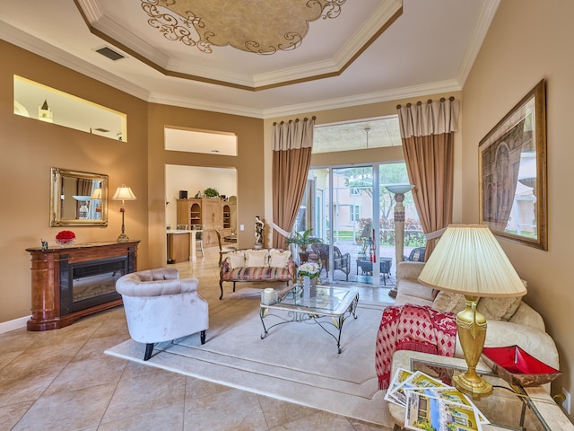 living room featuring a raised ceiling, ornamental molding, and light tile patterned flooring