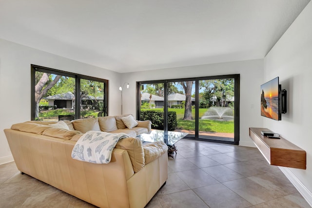 tiled living room featuring plenty of natural light