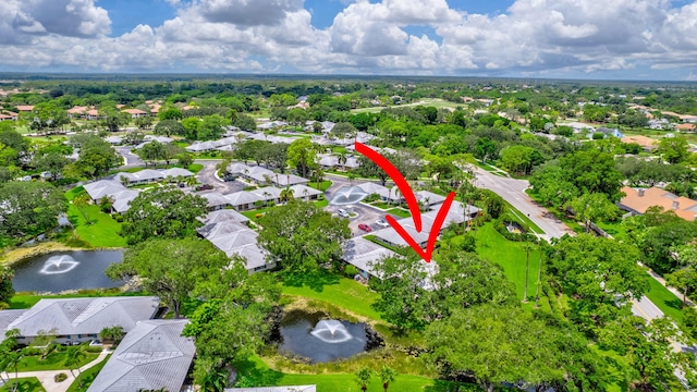 birds eye view of property featuring a water view and a residential view