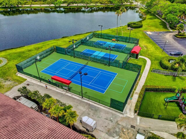 birds eye view of property with a water view