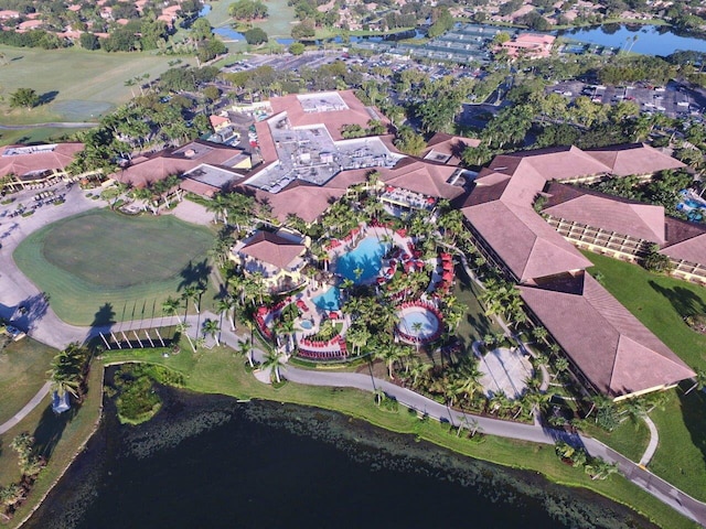 birds eye view of property featuring a water view and a residential view