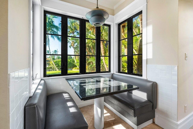 sunroom / solarium featuring a healthy amount of sunlight and a jacuzzi