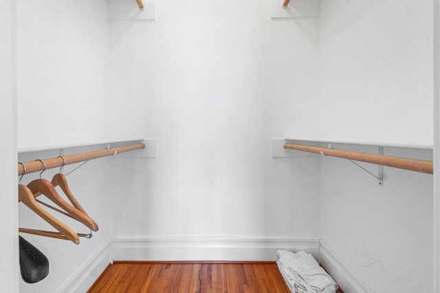 spacious closet with wood finished floors