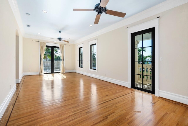 spare room with crown molding, recessed lighting, visible vents, light wood-style floors, and baseboards