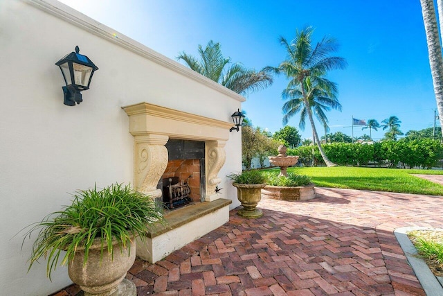 view of patio / terrace with a fireplace