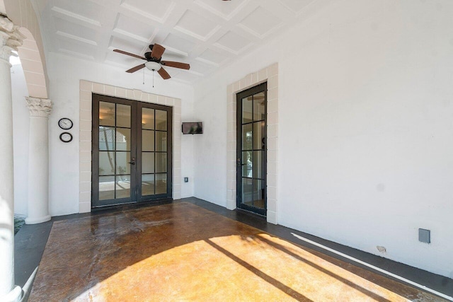 view of exterior entry featuring a ceiling fan and french doors