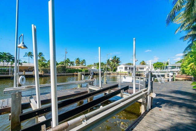 dock area featuring a water view and boat lift