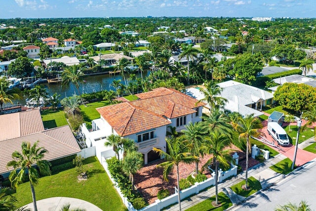 birds eye view of property with a water view and a residential view