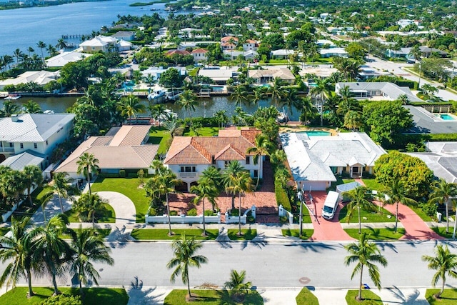 drone / aerial view featuring a water view and a residential view