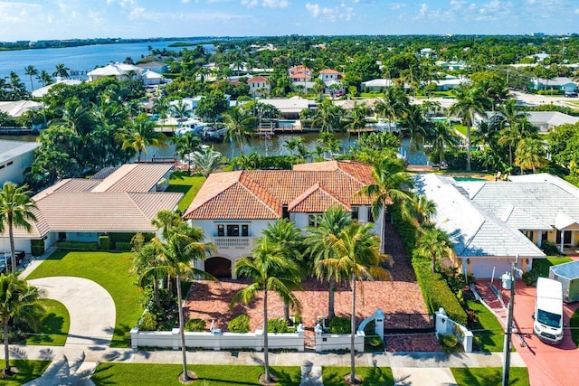 birds eye view of property with a water view and a residential view