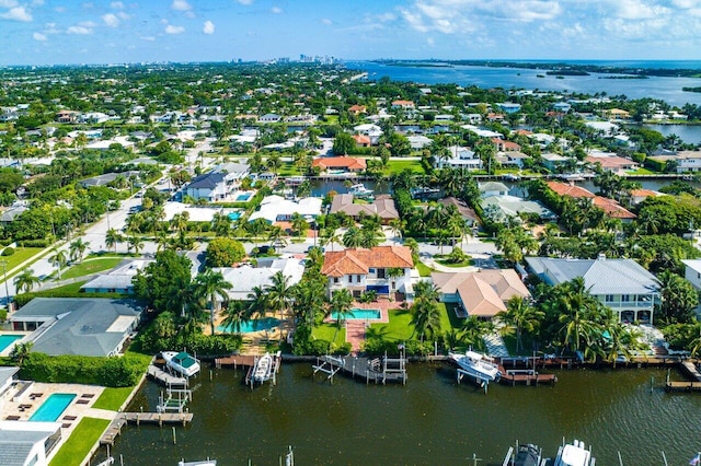 birds eye view of property with a residential view and a water view