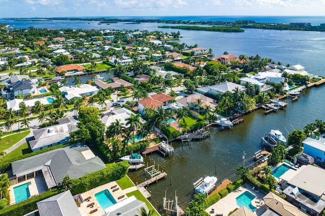 bird's eye view featuring a residential view and a water view