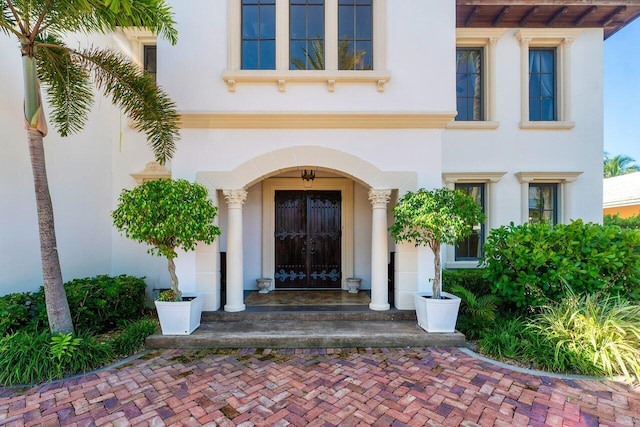 doorway to property with stucco siding