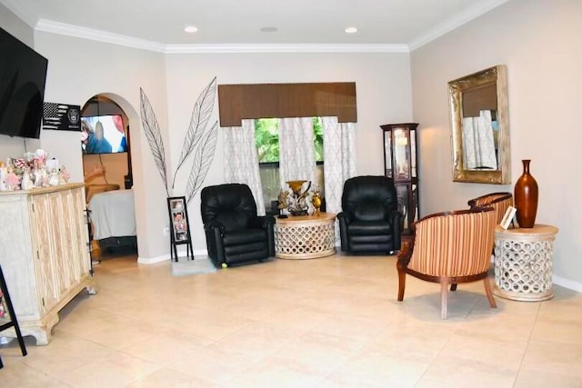 living area with crown molding and light tile patterned floors