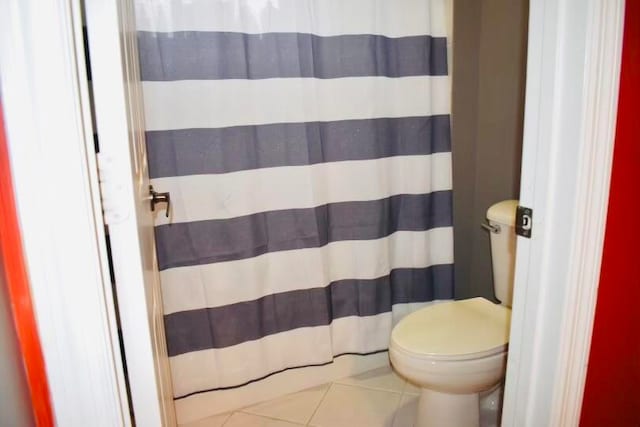 bathroom featuring tile patterned floors and toilet