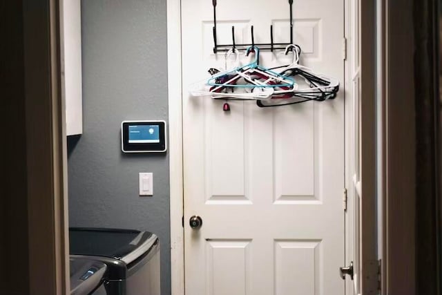 interior details featuring washer and clothes dryer