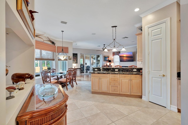 kitchen with sink, crown molding, light tile patterned floors, and light brown cabinets