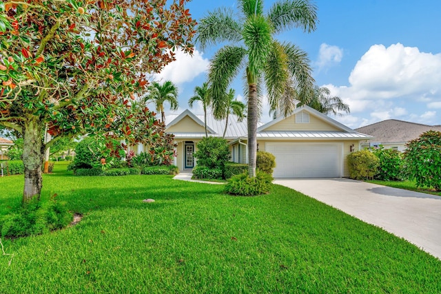 view of front of house featuring a front yard and a garage