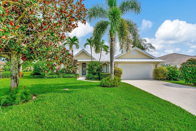 view of front of home featuring a garage and a front yard