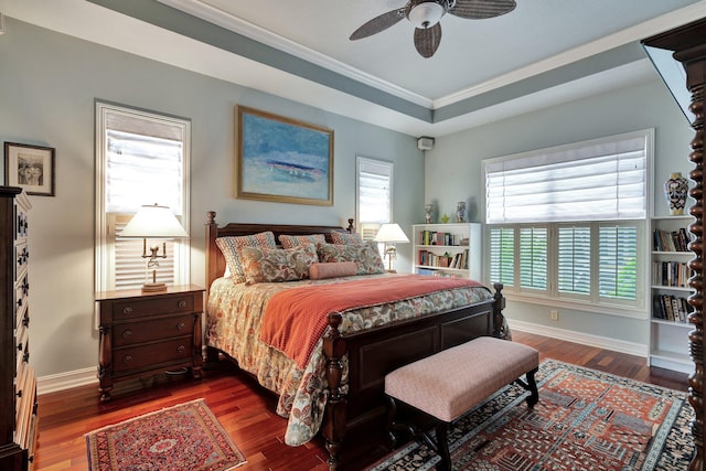 bedroom featuring hardwood / wood-style flooring, multiple windows, and ceiling fan