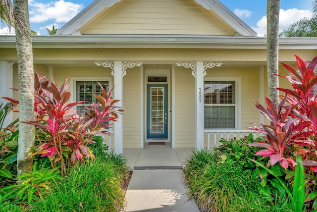 view of exterior entry featuring a porch