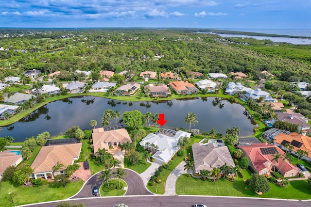 birds eye view of property with a water view