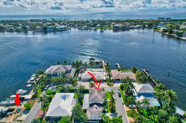 birds eye view of property with a water view